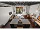 Open-concept living space with modern kitchen island, a comfortable sectional, and large windows for natural light at 517 King St # 13, Charleston, SC 29403