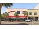 A street view featuring a commercial building with palm trees and classic architectural details at 517 King St # 13, Charleston, SC 29403