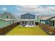 Spacious backyard with a patio, outdoor furniture, and well-maintained lawn at 518 Sound Dr, Summerville, SC 29486