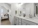 Bright bathroom with double sinks, white countertops, and access to the bedroom at 518 Sound Dr, Summerville, SC 29486
