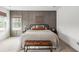 Elegant bedroom featuring a gray accent wall, stylish decor, and large windows for natural light at 518 Sound Dr, Summerville, SC 29486