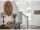 Stylish entryway with hardwood floors, decorative accents, and view of front door and staircase at 518 Sound Dr, Summerville, SC 29486
