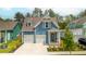 Charming blue two-story home with white trim, two-car garage, and landscaped front yard at 518 Sound Dr, Summerville, SC 29486
