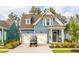 Charming two-story home with a two-car garage and a manicured front yard at 518 Sound Dr, Summerville, SC 29486