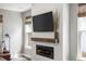 Contemporary fireplace with shiplap surround, wood mantel, and mounted TV at 518 Sound Dr, Summerville, SC 29486