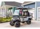Golf cart on a driveway of a house with an American flag displayed in the yard at 518 Sound Dr, Summerville, SC 29486