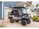 Golf cart parked in front of the house showing the custom seats at 518 Sound Dr, Summerville, SC 29486