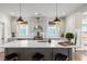 Updated kitchen features a large island with bar seating and stainless steel appliances at 518 Sound Dr, Summerville, SC 29486