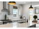Modern kitchen boasts stainless appliances, white subway tile, and stylish pendant lights at 518 Sound Dr, Summerville, SC 29486