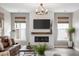 Cozy living room with hardwood floors, fireplace, and comfortable seating, with a view of the kitchen at 518 Sound Dr, Summerville, SC 29486