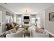 Spacious living room featuring a fireplace, large windows, and plush seating arrangement at 518 Sound Dr, Summerville, SC 29486