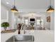 Open concept living area viewed from the kitchen featuring lots of natural light and a fireplace at 518 Sound Dr, Summerville, SC 29486