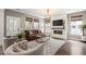 Bright living room boasts a modern fireplace, comfortable seating, and large windows at 518 Sound Dr, Summerville, SC 29486