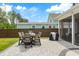 Charming patio with stone pavers, dining set, and screened-in porch providing a great outdoor living space at 518 Sound Dr, Summerville, SC 29486