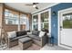 Relaxing sunroom featuring cozy seating, neutral decor, and an outdoor view at 518 Sound Dr, Summerville, SC 29486
