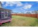 Expansive backyard with lush green grass, a wood fence and a trampoline that's perfect for outdoor activities at 533 Richfield Way, Summerville, SC 29486