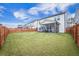 Well-maintained backyard featuring a wood fence, an enclosed porch and plenty of green space for outdoor enjoyment at 533 Richfield Way, Summerville, SC 29486