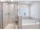 Bright bathroom showcasing a tiled shower, a soaking tub and a window at 533 Richfield Way, Summerville, SC 29486