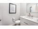 Elegant half bathroom featuring a granite countertop, modern sink, and decorative art at 533 Richfield Way, Summerville, SC 29486