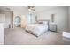 Airy bedroom featuring a ceiling fan, large windows, and stylish furniture and decor at 533 Richfield Way, Summerville, SC 29486