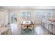 Dining room with a dark wooden table and fabric chairs, bright windows, and modern decor at 533 Richfield Way, Summerville, SC 29486
