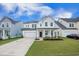 Charming two-story home featuring a well-manicured lawn, two-car garage, and a welcoming front porch at 533 Richfield Way, Summerville, SC 29486