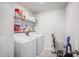 Functional laundry room with modern washer and dryer, and convenient shelving for storage solutions at 533 Richfield Way, Summerville, SC 29486