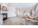 Open-concept living space with fireplace flowing into the kitchen and dining area at 533 Richfield Way, Summerville, SC 29486