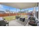 Covered screened porch with seating offers a comfortable outdoor space, perfect for enjoying the backyard at 533 Richfield Way, Summerville, SC 29486