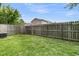 Spacious backyard features a wooden fence and lawn at 5737 Dewsbury Ln, North Charleston, SC 29418