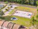 Aerial view of a basketball court, playground and park, designed for recreational activities, right in the neighborhood at 5737 Dewsbury Ln, North Charleston, SC 29418