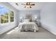 Bedroom featuring carpeted floors, a large window with a view, and light blue painted walls at 5737 Dewsbury Ln, North Charleston, SC 29418