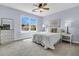 Cozy bedroom features a ceiling fan, window overlooking the neighborhood, and neutral color scheme at 5737 Dewsbury Ln, North Charleston, SC 29418