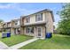 Charming townhome with brick and vinyl siding, complemented by a well-maintained front yard at 5737 Dewsbury Ln, North Charleston, SC 29418