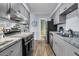 Well-lit kitchen with stainless steel appliances and stylish cabinetry at 5737 Dewsbury Ln, North Charleston, SC 29418