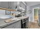 Modern kitchen features stainless steel appliances and countertops at 5737 Dewsbury Ln, North Charleston, SC 29418