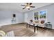 Bright living room with a large window and ceiling fan at 5737 Dewsbury Ln, North Charleston, SC 29418