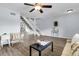 Bright and open living room with modern flooring at 5737 Dewsbury Ln, North Charleston, SC 29418