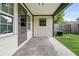 Covered back patio with a concrete floor and an adjacent grassy area at 5737 Dewsbury Ln, North Charleston, SC 29418