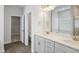 Elegant bathroom featuring dual sinks, modern fixtures, and a separate tub, creating a luxurious experience at 603 Yellow Leaf Ln, Summerville, SC 29486