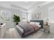 Well-lit bedroom featuring a comfortable bed, stylish decor, and soft carpeting at 603 Yellow Leaf Ln, Summerville, SC 29486
