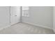 Bright bedroom featuring a closet and a window, with plush carpeting and neutral walls at 603 Yellow Leaf Ln, Summerville, SC 29486