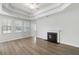 Bright living room features a fireplace and large windows for ample natural light at 603 Yellow Leaf Ln, Summerville, SC 29486