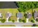Aerial view of neighborhood showcasing well-maintained homes, green lawns, and mature trees at 606 Knowledge Dr, Ladson, SC 29456