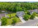 Aerial view of home and backyard, showcasing pond views and mature trees at 606 Knowledge Dr, Ladson, SC 29456