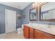 A well-lit bathroom with a double vanity, providing ample counter space and storage at 606 Knowledge Dr, Ladson, SC 29456