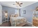 A comfortable bedroom with soft lighting, a plush bed, and stylish decor at 606 Knowledge Dr, Ladson, SC 29456