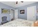 Cozy bedroom featuring a queen bed, ceiling fan, and baseball themed decor at 606 Knowledge Dr, Ladson, SC 29456