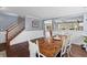 Formal dining room boasts hardwood floors, wainscoting, and an open layout at 606 Knowledge Dr, Ladson, SC 29456