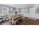 Traditional dining room with natural lighting, wood floors, and stylish decor at 606 Knowledge Dr, Ladson, SC 29456